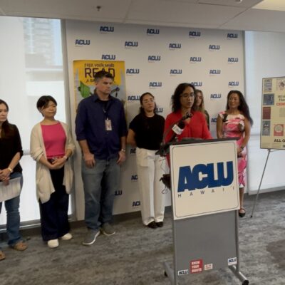 Image of people speaking at a podium