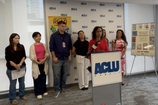 Image of people speaking at a podium
