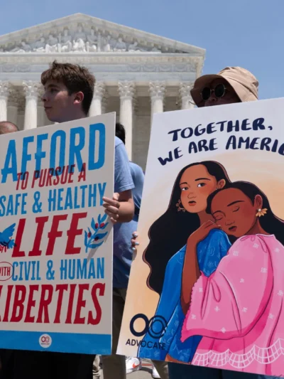 Activists celebrate the Supreme Court's ruling on birthright citizenship, outside of the Supreme Court on Capitol Hill, Tuesday, June 30, 2026, in Washington.