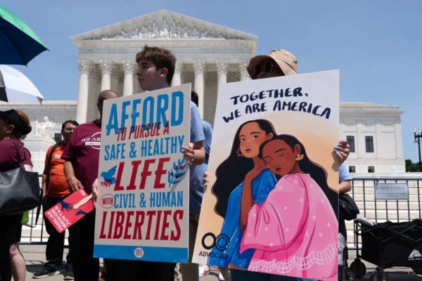 Activists celebrate the Supreme Court's ruling on birthright citizenship, outside of the Supreme Court on Capitol Hill, Tuesday, June 30, 2026, in Washington.