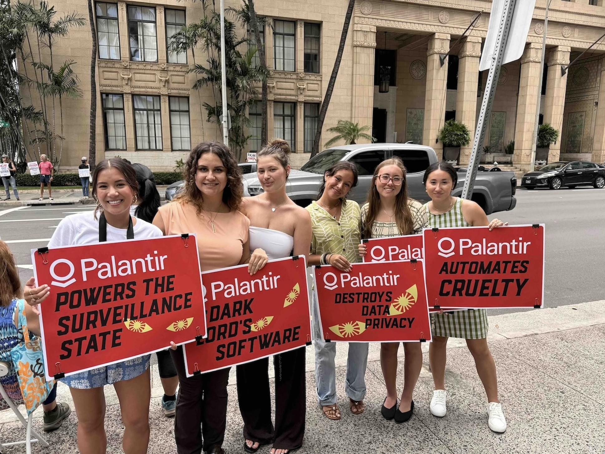 Catherine Titzer, left, who recently graduated from Stanford University and is now a community field fellow for ACLU of Hawaiʻi, pictured with Palantir protesters. Photo by Kelsey Kukaua Medeiros (Aloha State Daily Staff)