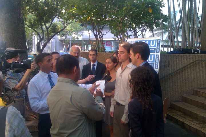 Tess and Jaime Meier, with their attorneys, speak to the press.