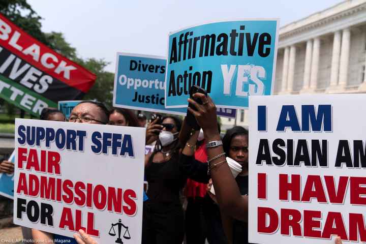 Demonstrators protest outside of the Supreme Court in Washington.