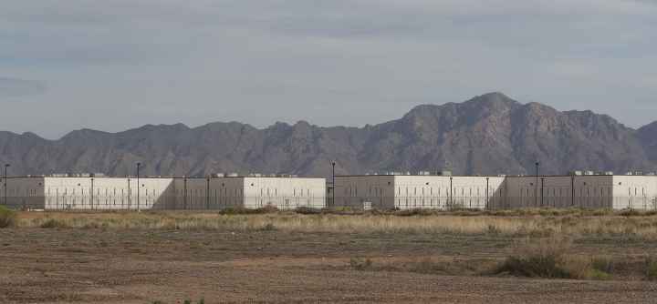 Saguaro-Correctional-Facility-CCA-Fence-CCA-mountains-Eloy-Arizona1.jpg