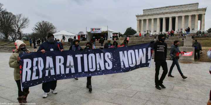 Demonstrators with the Reparationist Collective gather at the Lincoln Memorial in Washington, D.C. to demand reparations from slavery and inequity