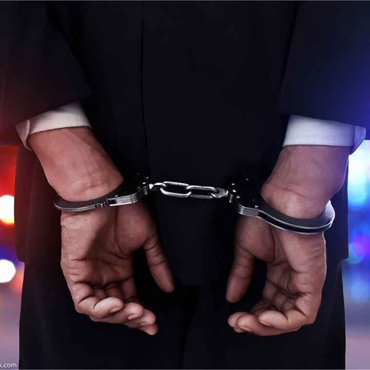 Businessman in handcuffs