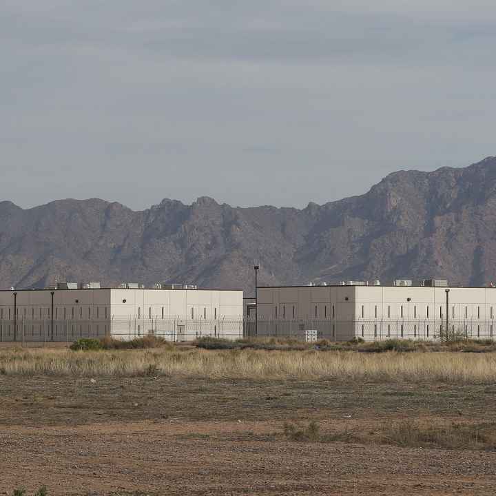 Saguaro-Correctional-Facility-CCA-Fence-CCA-mountains-Eloy-Arizona1.jpg